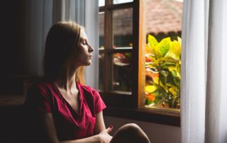 Woman staring out window